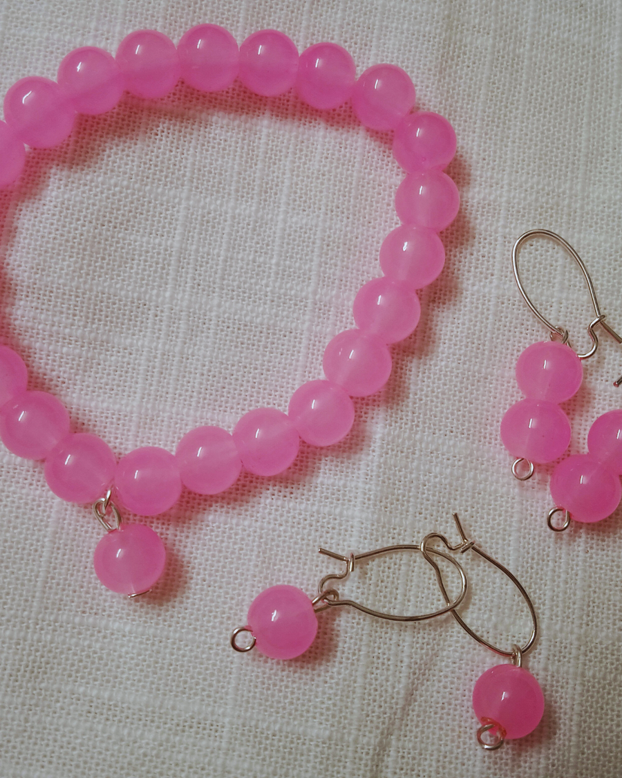 pink beaded bracelete with ear rings